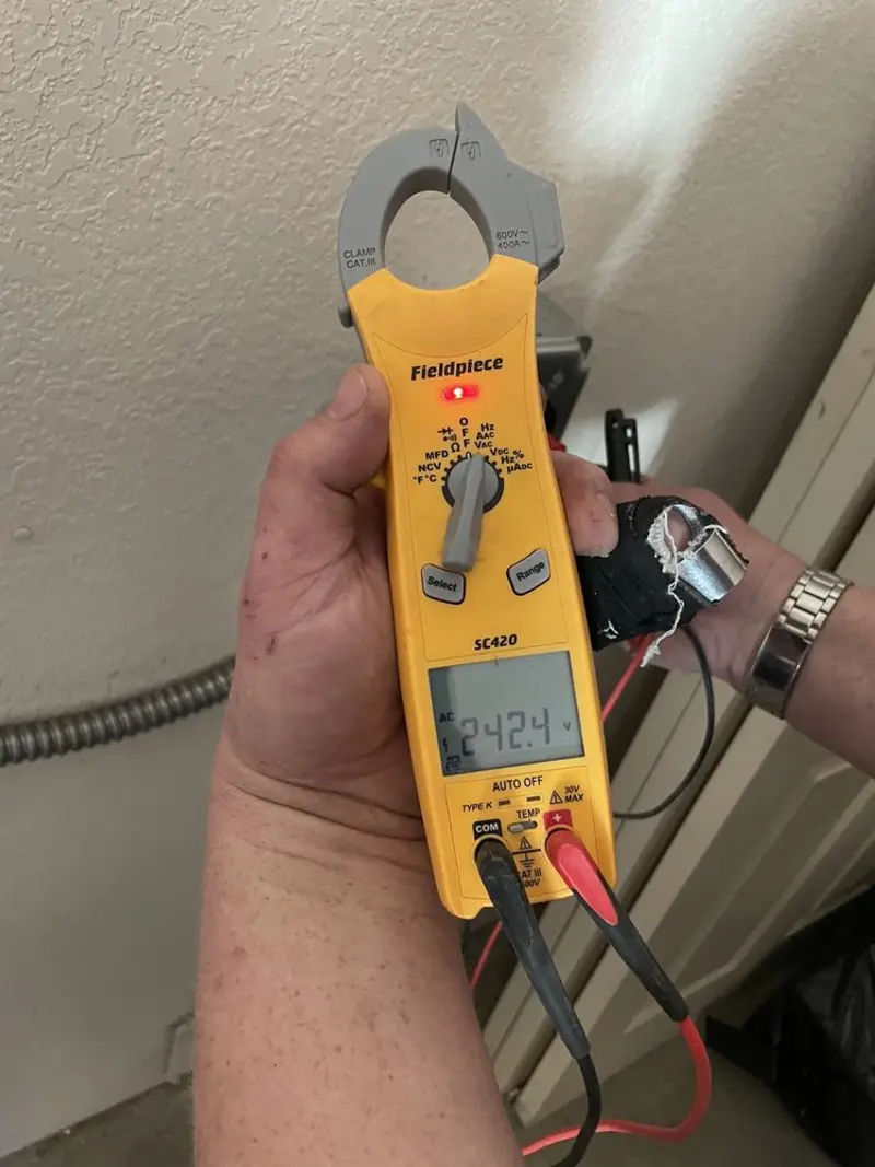 Voltage testing with clamp meter during Ceiling Fan Installation in Brookings